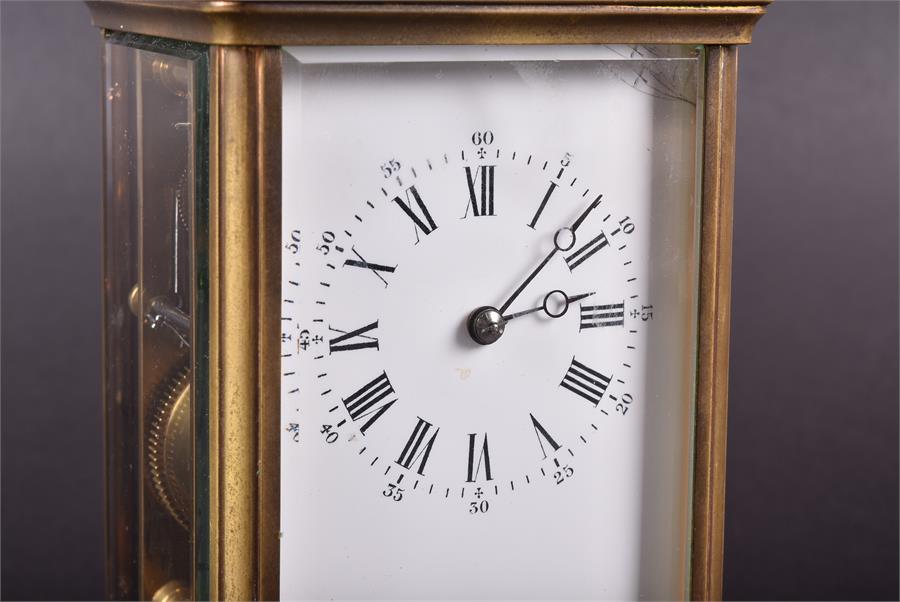A Victorian brass carriage clock the white enamel dial with black Roman numerals, striking on a - Image 2 of 8