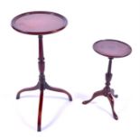 A large Georgian style mahogany tripod wine table together with a smaller tripod wine table. (2)