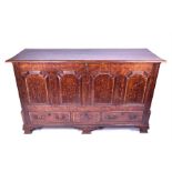 A very large 18th century oak coffer the plain top with moulded rim, two small drawers within,