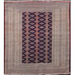 A red and blue ground rug with central double and half pole medallion decoration, multi-bordered and