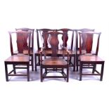 A matched set of six 18th century oak dining chairs including one carver, with solid seats, vase