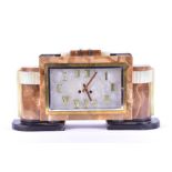 A large and impressive mixed onyx and slate mantel clock in the Art Deco style of stepped
