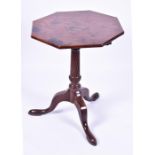 A Georgian mahogany tripod table the shaped octagonal top supported on a tripod base with a fluted