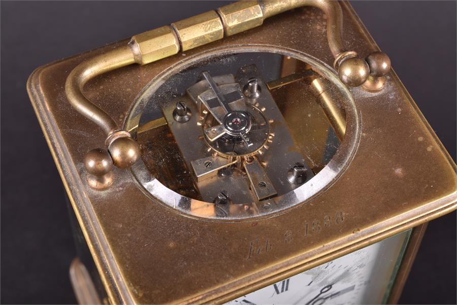 A Victorian brass carriage clock the white enamel dial with black Roman numerals, striking on a - Image 7 of 8
