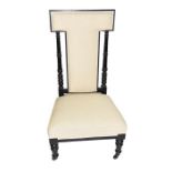 An Edwardian upholstered prayer chair with cream seat and turned ebonised frame, 104 cm high x 57 cm
