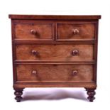 A 19th century oak chest of drawers of small proportions, comprising two short and two long
