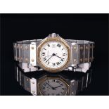 A Cartier Roadster stainless steel and gold automatic wristwatch the circular white dial with