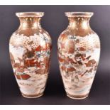 A pair of early 20th century Japanese Satsuma vases of tapered form, decorated with panels of