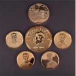 Six commemorative Chairman Mao gilt coins largest 5 cm diameter.
