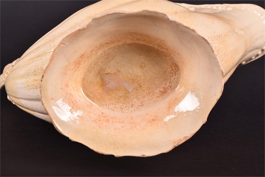 An 18th century creamware shell shaped sauce boat the rim with moulded scrolled decoration, with - Image 6 of 6