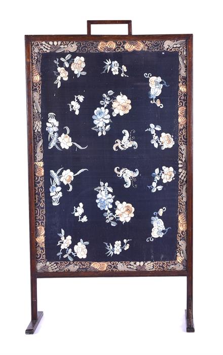 A late 19th / early 20th century Chinese silk room screen the dark blue silk, gilt bordered with