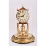 A German brass anniversary clock under a glass dome the enamel dial signed Kundo, with rotating