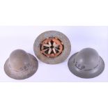 Three British second world war Zuckerman (civil defence organisations) helmets each marked with