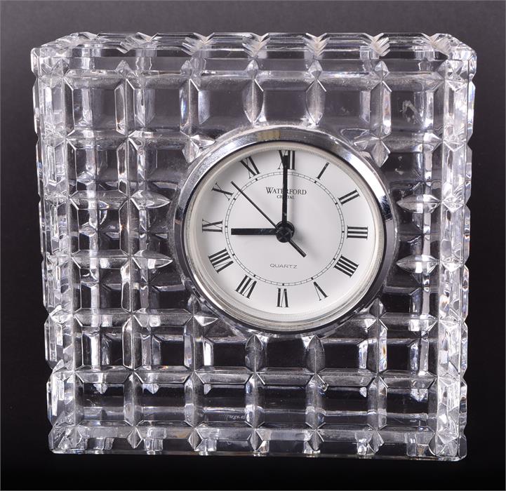 A Waterford cut crystal mantel clock inset with a white dial with black Roman numerals. Signed to