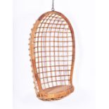 A 1960s Dutch Rohe, Noordewolde cane, wicker, and rattan hanging chair the cane and rattan frame