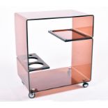 A 1970s-80s brown glass bent Perspex drinks trolley the rectangular body with open back and front