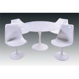A mid to late 20th century Knoll 'Tulip' table and four 'Tulip' dining chairs designed by Eero