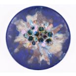 A 1960s West German Ruscha wall plate decorated with fourteen applied discs glazed in glossy blue,