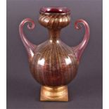 A late 19th century Murano glass vase on stand the optical ribbed red body with gold aventurine