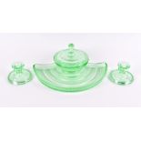 A 1930s-50s Bagley green pressed glass dressing table set comprising a powder jar with lid, two