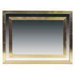 A 1960s-70s brass and chrome framed mirror the rectangular brass frame set with chrome plated linear