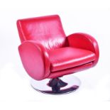 A 1960s French or Italian red leather armchair in the style of Marco Zanuso, of generous