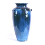 A large and impressive stoneware vase or planter of tapering cylindrical form with a cylindrical