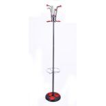 A 1960s coat and umbrella stand the metal frame finished in black, the top with six bent rod coat or