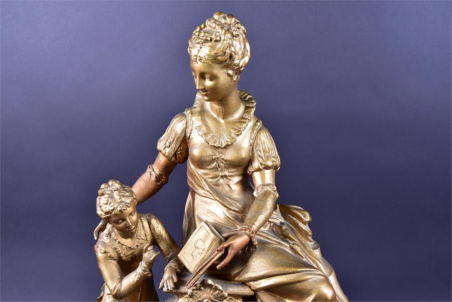 A late 19th century French spelter mantel clock formed as a woman and child reading a book, upon a - Image 3 of 9