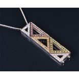 An unusual 18ct white gold, diamond, pink and yellow sapphire, and demantoid garnet pendant of