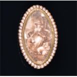 A 19th century yellow metal portrait brooch the oval portrait depicting a young Georgian maiden