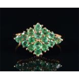 A 9ct yellow gold and emerald cluster ring size L, 1.7 grams.