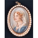 A 19th century 15ct yellow gold mounted painted miniature pendant of oval form, depicting a young