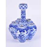 A late 19th century Chinese six stem blue and white tulip vase decorated on the body all round