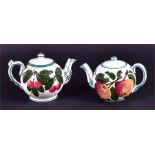 Two small Wemyss teapots one hand painted with apples, the other cherries, both with finial lids
