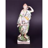 An early 19th century or earlier Staffordshire figure depicting Diana The Huntress presented in