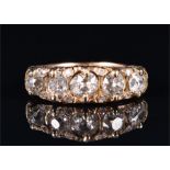 A yellow gold and five stone diamond ring set with five graduated old cut diamonds, of approximately