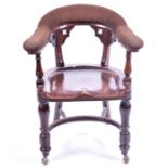 A large late 19th / early 20th century office / club chair  the upholstered back with pierced