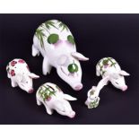 Plictha pig figures to include a large example decorated with thistles, (24 cm long), a small pig