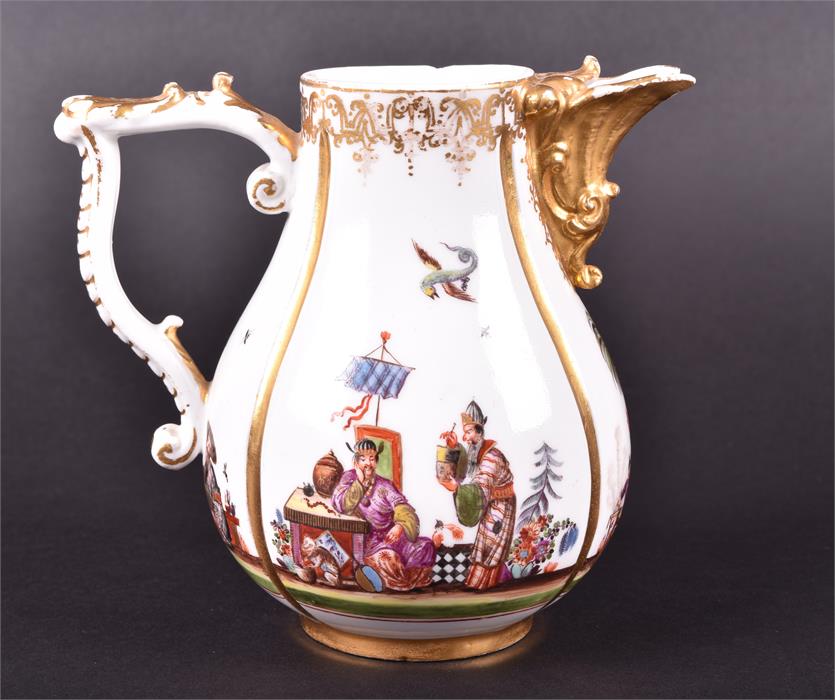 A 19th century Meissen milk jug segmented in four parts and decorated with scenes of Oriental