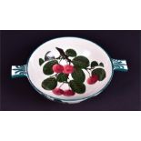 A Wemyss quaich decorated with hand painted cherries of typical form with twin handles decorated