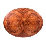 A Victorian burr walnut breakfast table the oval top in well matched burr walnut veneers,