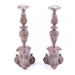 A pair of 18th century or earlier painted gilt gesso candlesticks with foliate stems, and