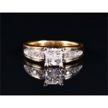 An 18ct yellow gold and diamond ring centred with a square of four square-cut diamonds, the