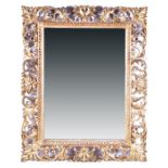 A 19th century wall mirror set within a cut gilt wooden frame with scrolling pierced acanthus cut