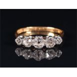 An 18ct yellow gold and diamond ring set with five graduated old-cut diamonds of approximately 1.0