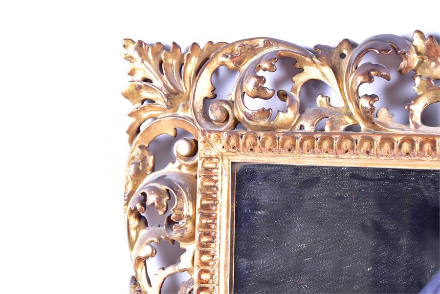 A 19th century wall mirror set within a cut gilt wooden frame with scrolling pierced acanthus cut - Image 2 of 4