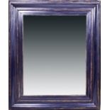 A large wall mirror with black painted frame. 126 x 104 cm.