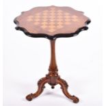 A Victorian inlaid chess top table with inlaid top with ebonised scalloped rim, and supported on a