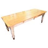 A large pine farmhouse refectory / dining room table with a single frieze drawer and supported on